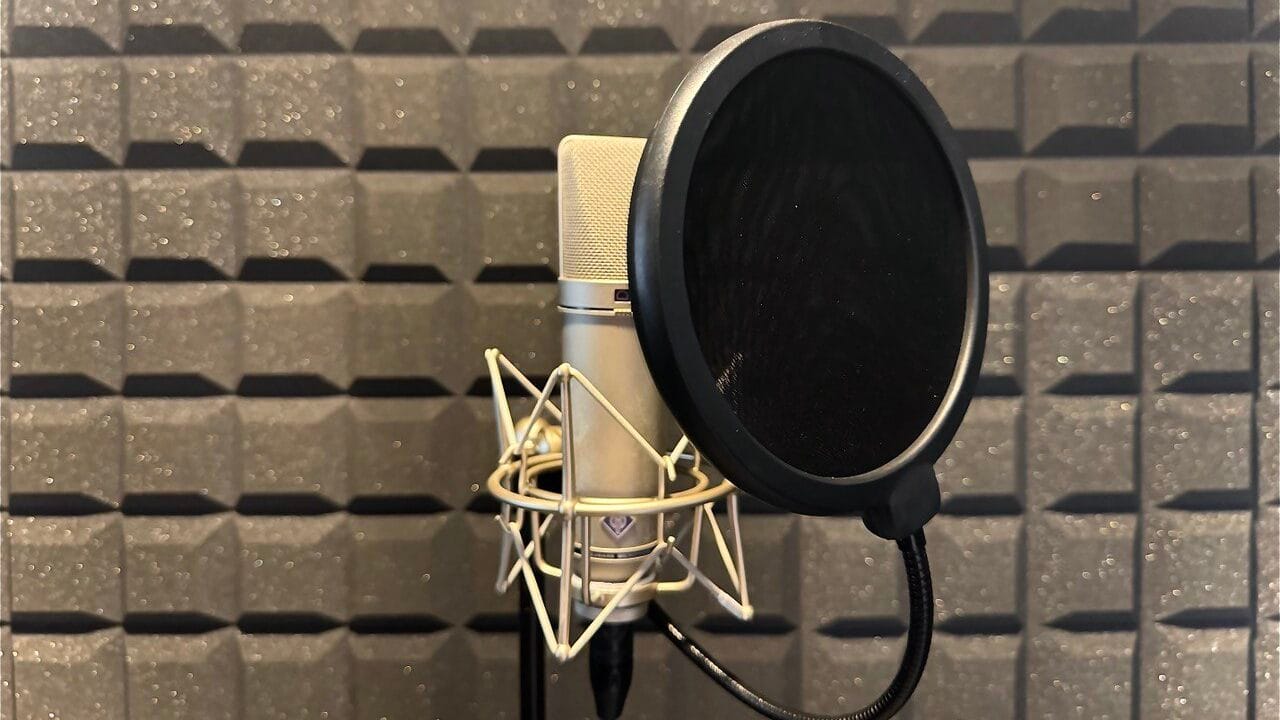 Condenser microphone with pop filter in a Dubai vocal recording booth
