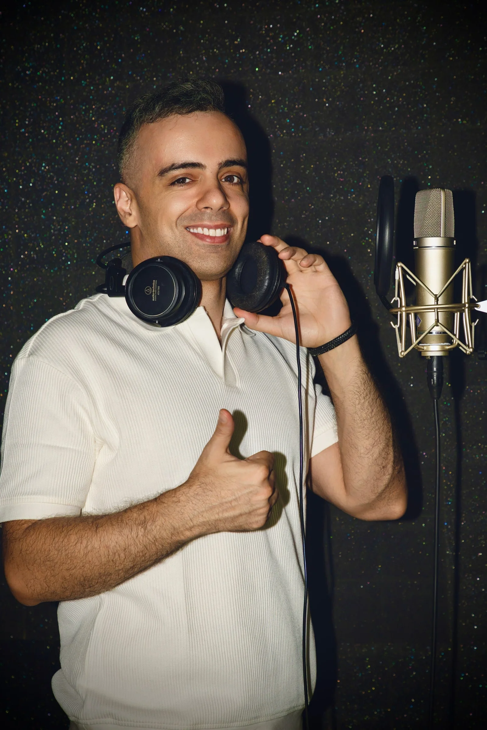How to find your vocal range - singer testing notes at a microphone in a Dubai recording studio
