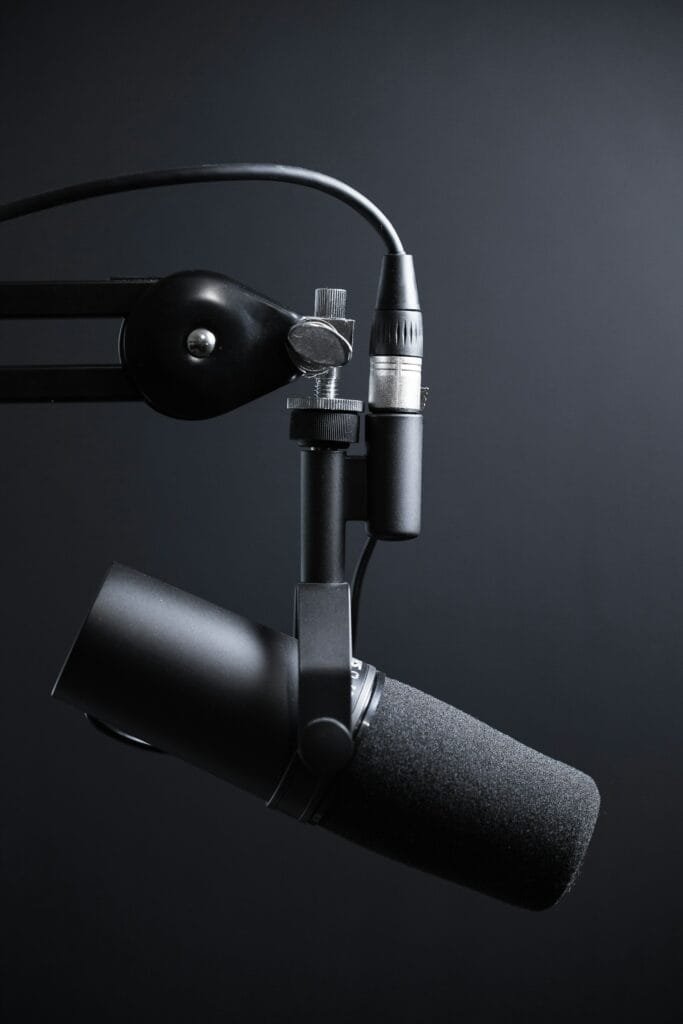 Podcast recording studio in Dubai with a professional condenser microphone and headphones