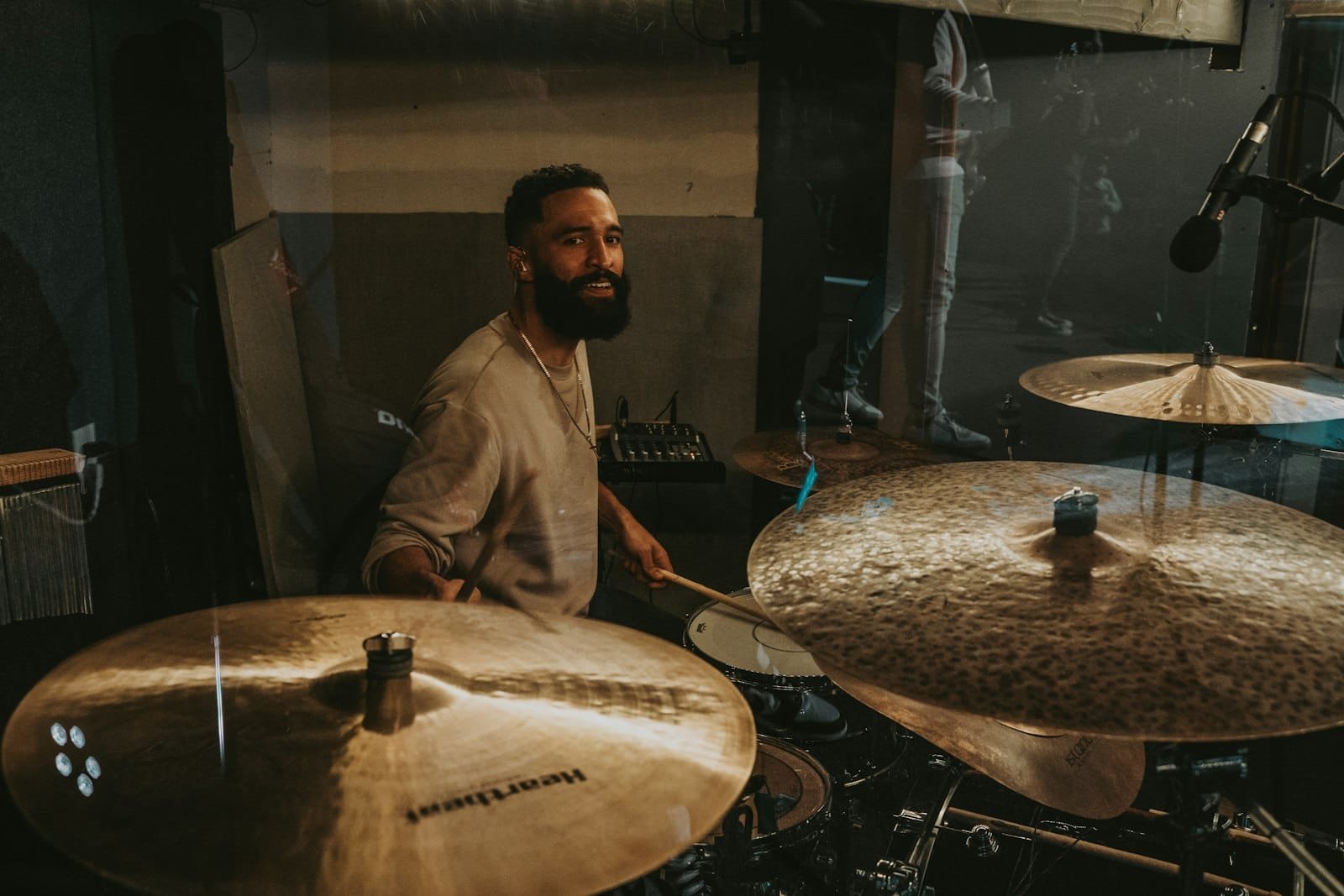 Recording a drum kit with microphones in a professional studio in Dubai
